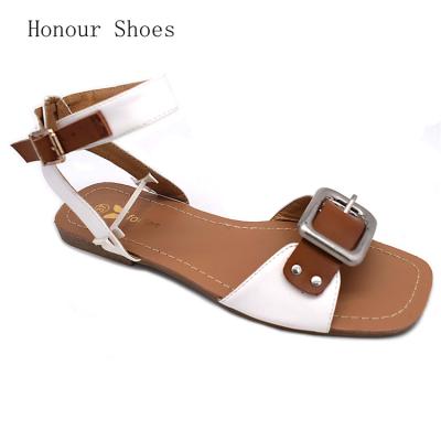 China Popular TPR Fashion Buckle Leather Innovative Flat Top Metal Decorative Sandals for sale