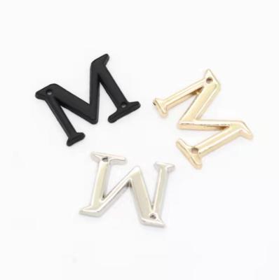 China Custom Washable Metal Brand Gold Branded Sewn Metallic Shoe Stud Metal Logo Label For Shoes Clothing for sale