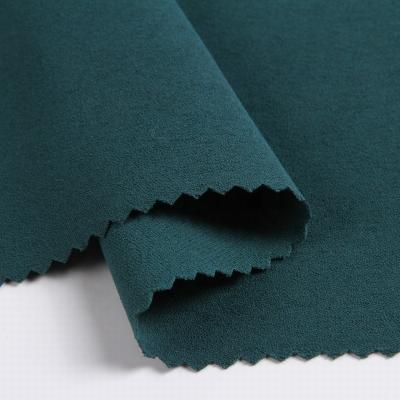 China Green Stretch TSP Plain Dye 98% Polyester 2% Spandex Woven Stretch Fabric Fabric for sale