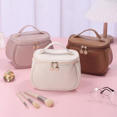 China Fashion Large Capacity Travel Cosmetic Bag Waterproof To Make Up Storage Stitched Makeup Bag Wide Open Skin Care Bag For Woman for sale