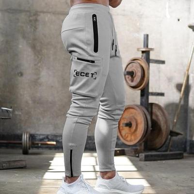 China OEM Men's Gym Sport Drawstring Breathable Pants And Trousers Slim Fitness With Pockets Sports Jogging Pants Trousers for sale