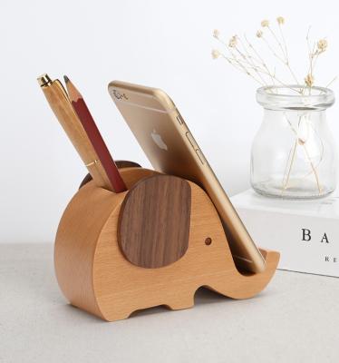 China Eco-friendly Multi Function Fashion Elephant Shaped Wooden Phone Stand Custom Logo Phone Stand Pen Holder for sale