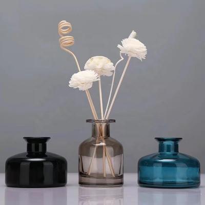 China New Design Eco-friendly Recyclable Luxury Round Reed Diffuser Glass Bottle Black Colored 50Ml 100Ml 150Ml 200Ml Reed Diffuser Bottle for sale