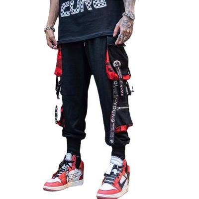 China New Trend Black Breathable Stylish Loose Hip Hop Pants Side Pockets Stitching Strappy Cargo Pants for sale