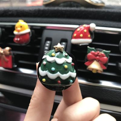 China 3D New 2021 Hot Cartoon Resin Santa in Car Christmas Decoration with Spout Clip Gift Decoration Car for sale