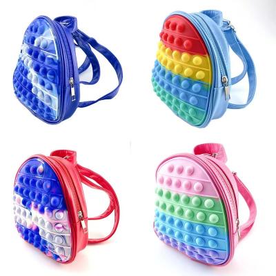 China New Decompression Silicone Rainbow Mini Backpack Kids School Bags Push Noise Pushing Person Toy Backpack for sale