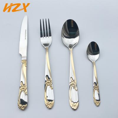 China Viable gold flower handle common stainless steel cutlery with dinner fork dinner tooth spoon tea spoon gold flatware cutlery set for sale