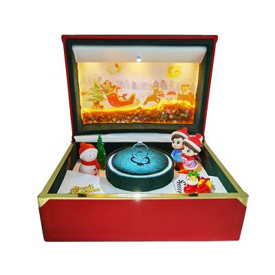 China Custom Wholesale Newest Luxury Christmas Jewelry Ring Gift Box Music Cassette USB Automatic Rotating Filling for sale