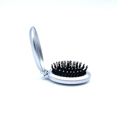 China Environmentally Friendly Private Label Foldable Mini Hot Foldable Comb Home Use Portable Hair Brush for sale