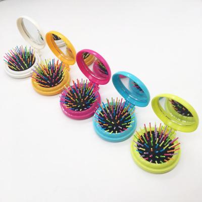 China Foldable Portable Foldable Plastic Hair Comb Mini Travel Hair Brush for sale