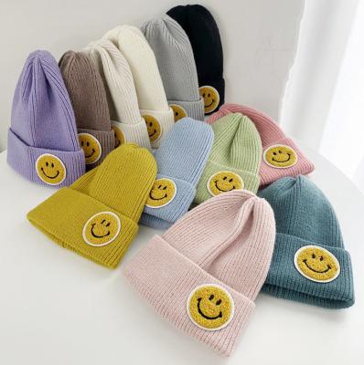 China Wholesale COMMON Hot Selling Smiley Face Knitted Winter Beanie Hat For Women for sale