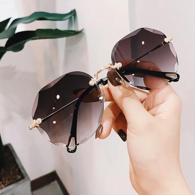 China Fashion Sunglasses Luxury Sunglasses 2022 Fashionable Hot Sale Quality Sun Glass Women Rimless Sunglasses for sale