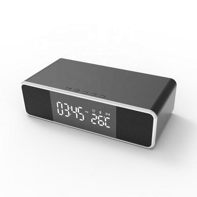 China New Multifunctional Mobile Phone Alarm Clock Wireless Charger With Speaker for sale