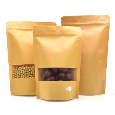 China Recycled Materials Stand Up Brown Recycled Paper Kraft Paper Food Bag Zipper Candy Bag With Clear Window for sale