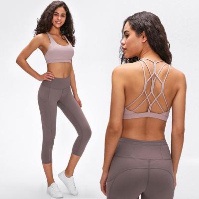 China Breathable the same 2021 lulu yoga underwear bra beauty female cross strap chest pad shockproof running sports fitness bra top vest for sale