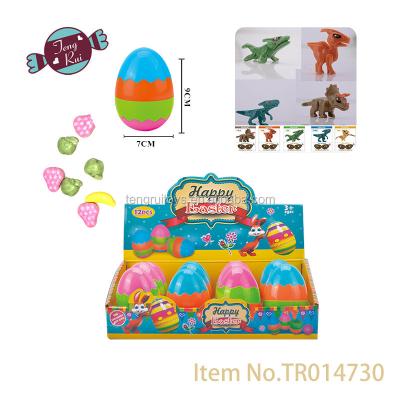 China Cartoon Toys New Product 7cm Egg Tumbler With Assembly Dinosaur Candy Toy for sale