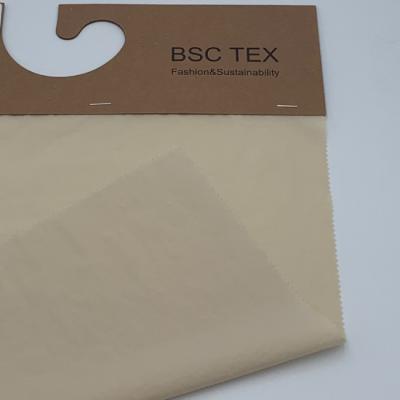 Cina Tessuto in nylon ripstop riciclato completamente opaco 40D taffetà stropicciato 65 gsm in vendita