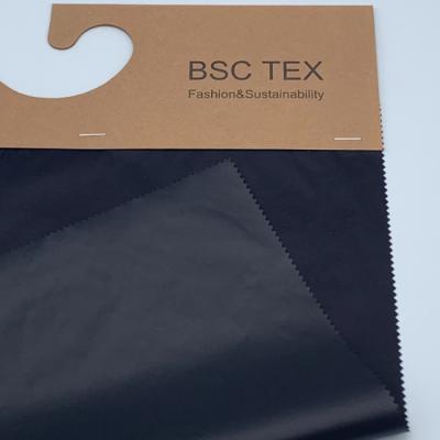 China Semi Dull 400T Recycled Ripstop Fabric Lightweight Waterproof Nylon Fabric for sale