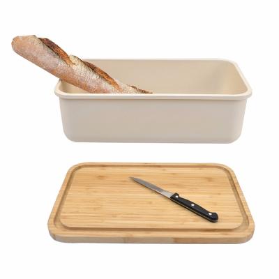 China Sustainable Bamboo Bread Box For Kitchen With Cutting Board Lid Food Storage Bread Keeper for sale