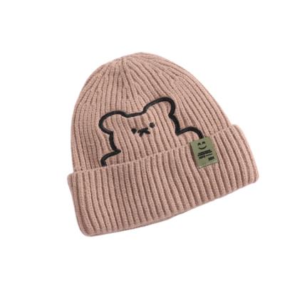 China COMMON Fashion High Quality Winter Outdoor Women Knitted Hats With Bear Printed For Girls for sale