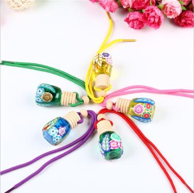 China Eco-friendly Car Air Freshener Polymer Clay Glass Hanging Car Perfume Bottle for sale