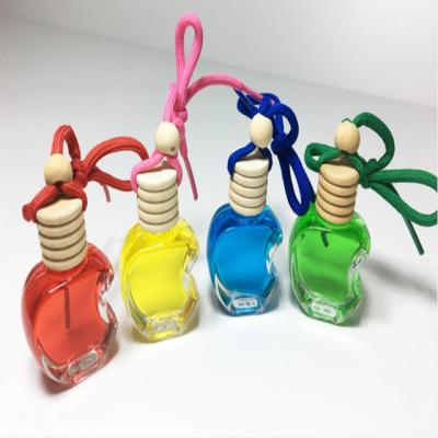 China Factory Supply Car Hanging Perfume Bottle Eco-friendly Apple Shape Glass Diffuser With Wooden Cap, Rope for sale