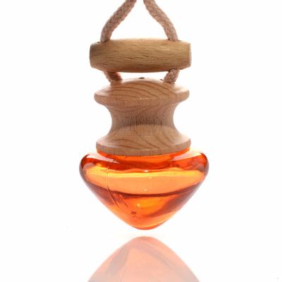 China Mini 8ml Car Perfume Bottle Eco-friendly Hanging Glass Heart Shaped Hanging Car Freshener for sale