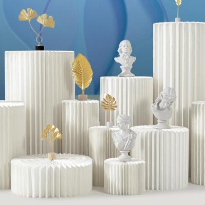 China Columnas de boda romanas de papel Pilar romano de papel plegable Columna de pilar con tapa acrílica para decoraciones de mesa de boda en venta