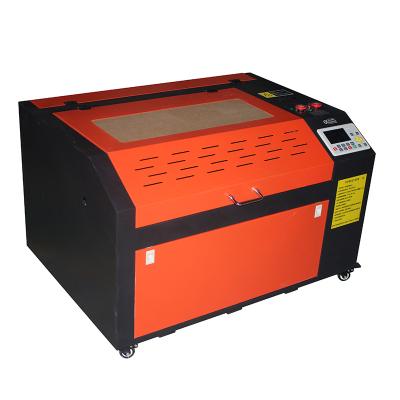 China Laser Engraving Mini Laser Engraver 4060 Fiber Wood 3D Crystal 4060 Laser Cutters Portable CO2 Laser Engraving Machine For Metal for sale