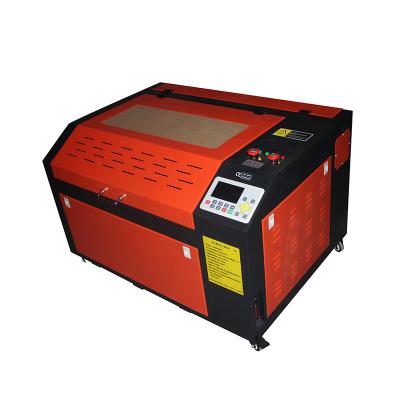 China Laser Engraving Hot Sale Desktop CO2 Laser Cutter Machine and Mini Laser Engraver for Wood Stone Marble Rubber Sheet for sale