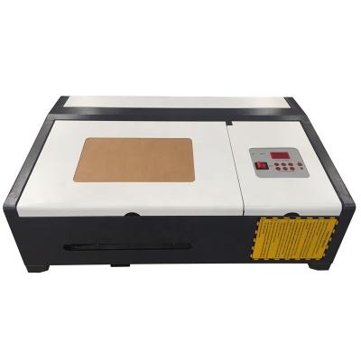 China Laser Engraving Laser Engraving Machine 40W CO2 3020 Laser Cutting Machine With Exhaust Fan USB Port for sale