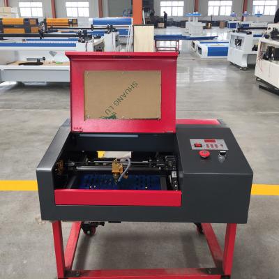 China Laser Engraving Newest 3020 Wood Laser Machine Indonesia DST Kenya Stone Japan Russia Italy India Metal Kingdom Key Leather White Acrylic Motor for sale