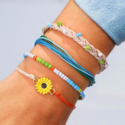 China Wholesale Ethnic Boho Hand Knitted Line Alloy Wax Drops Bracelet 2020 Daisy Sunflower Bracelet Set Friendship for sale