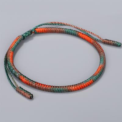 China Adjustable Braided Rope Lucky Bracelet Ethnic Tibetan Buddhist Luck Knots Gradient Color Bracelet for sale