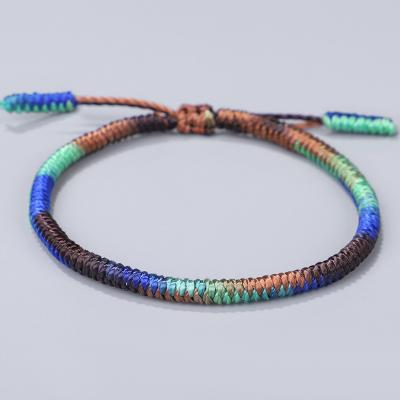 China Adjustable Braided Rope Lucky Bracelet Ethnic Tibetan Buddhist Luck Knots Gradient Color Bracelet for sale