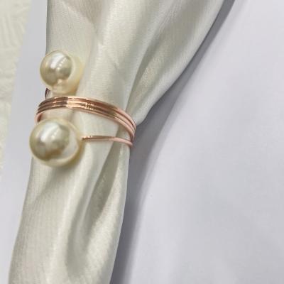 China Cheap Sale Custom Stocked Rose Gold Pearl Napkin Ring For Wedding Dinning for sale