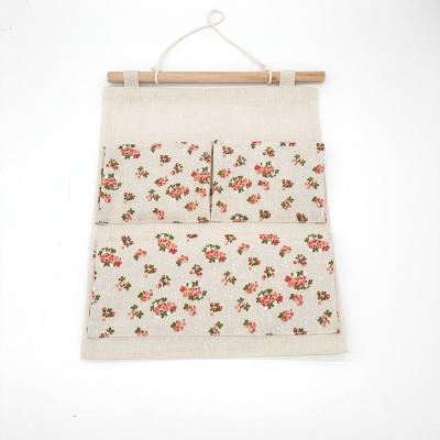 China Viable Wholesale Decorative Yulin Jiafu Canvas Door Cloth Wall Pockets/Cotton Cloth Wall Hanging Storage Bag for sale