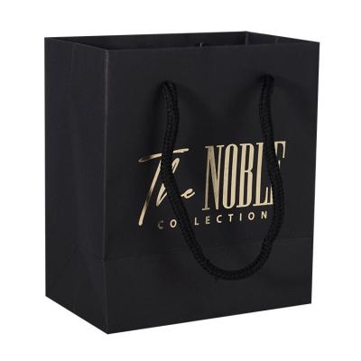 China Cheap wholesale black recyclable thank you shop tou luxury paper logo printed custom shopping bag for sale