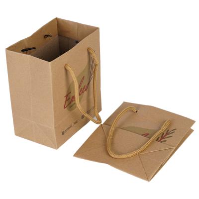 China Recyclable Strong Fashion Luxury Gift Packaging Packaging Custom Emboss Paper Bag With Handles for sale