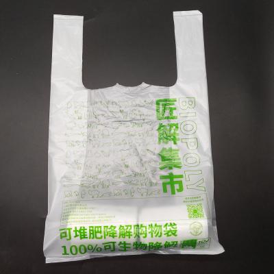 China BIODEGRADABLE custom environmental friendly plastic T-shirt fruit and vegetable bag carry 100% biodegradable shopping bags for sale