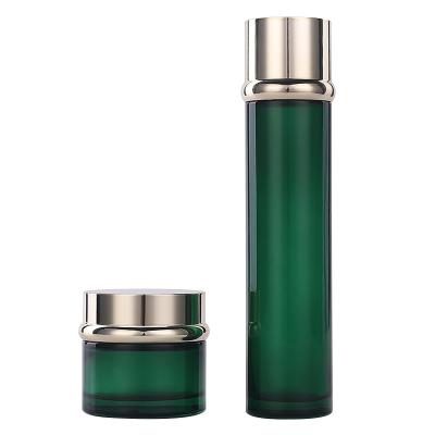 China Personal Care Customs Customs Logo 30g 50g 40ml 100ml 120ml High End Gold Silver Cap Dark Green Glass Bottle And Glass Jar Package for sale