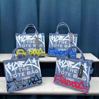 China Cute 2022 Summer Trend Graffiti Purse Handbag Gift Contrast Colors Geometric Cross Body Bag For Women Canvas Tote Bags for sale