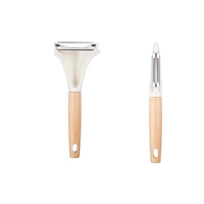 China Sustainable Multifunctional Kitchen Tools Stainless Steel Peeler with Wooden Handle for Vegetable and Fruit Peeling for sale