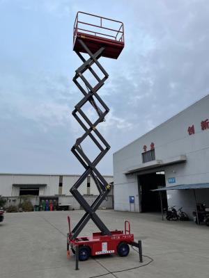 China Hochkapazität 320 kg Doppelschere Lift mit 12m Reichweite Zuverlässige und sichere hydraulische elektrische Luftplattform zu verkaufen