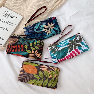 China Others Colorful Leaves Pattern Printed Clutch Bag Cheap Women Coin Purse Fashion Ladies Leisure Oxford Clutches for sale