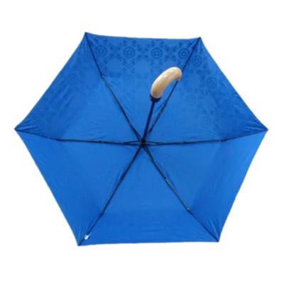 China Wholesale Cheap Rogue Girl Design Use Daily Cute Pongee Wooden Foldable Capsule Small Mini Umbrella for sale