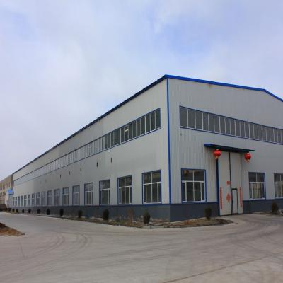 China Galvanized Steel Roof Steel Warehouse with Rolling Door for sale