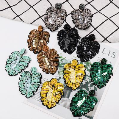 China FASHIONABLE Handmade Tropical Seed Pearl Boho Women's Green Plant Sequin Leaf Earrings Palm Leaf Earrings for sale