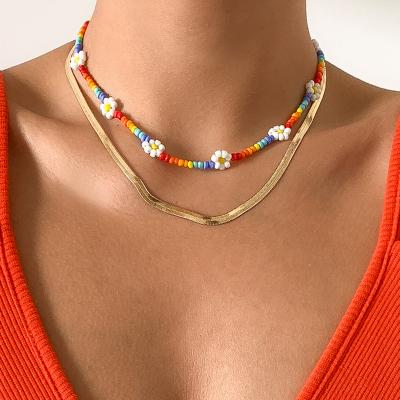 China NK-1254 Color Snake Bone Chain Flat Clavicle Necklace Small Bohemian Punk Metal Daisy Rice Beads Woven Necklace for sale