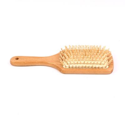 China Comfortable Wholesale Magic Natural Health Care Paddle Cushion Massage Hair Bamboo Wooden Comb for sale